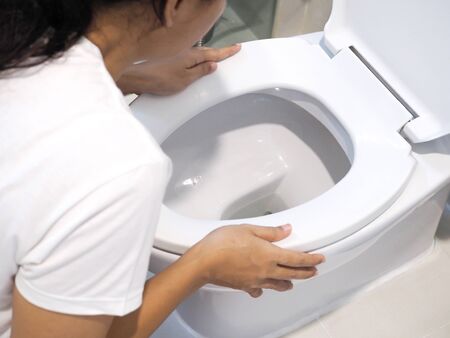 Asian women with acute illness, dizziness and nausea and vomiting.の写真素材