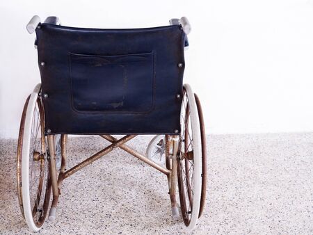 Old wheelchair and damaged, disabled car, Bad health concept and seriously ill and died.の写真素材