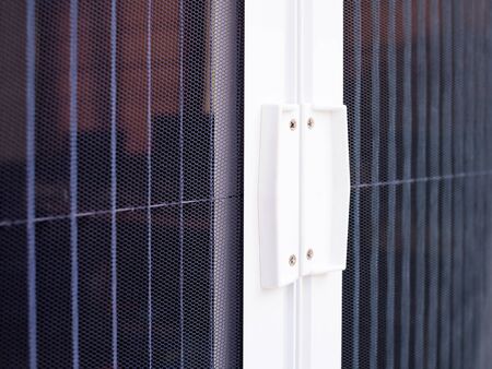 Close-up of door closed with mosquito net or mosquito wire screen.の写真素材