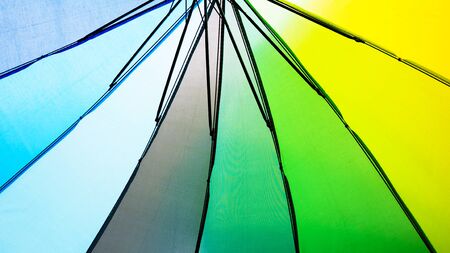 background color with Rainbow colorful umbrella.