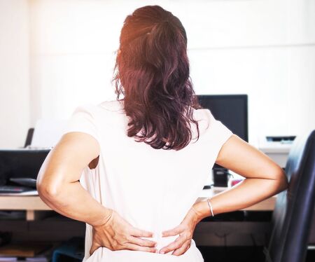 Women take hands to massage on the back and waist for relax muscles, relieve pain with body aches...