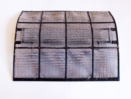 Cleaning air conditioners in the house. With dust and dirt on the air filter. Isolated on white...