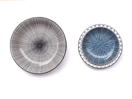 Top view of beautiful crockery set with porcelain ceramic plate round dish and cup bowl isolated on...