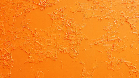 Abstract grunge background with orange yellow cement wallの写真素材