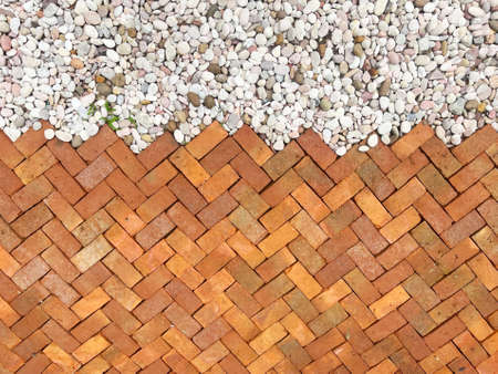 Pavement with pattern of brick blocks and stones. garden pathの写真素材