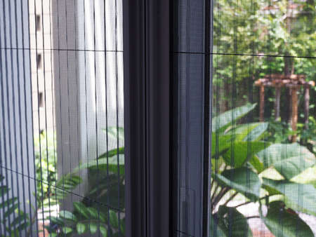 door with mosquito netting screen against wire mosquitoes and prevent insects.