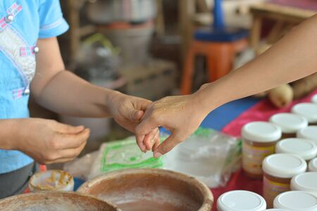 Turmeric is applied to the arm to healthy skin .の写真素材