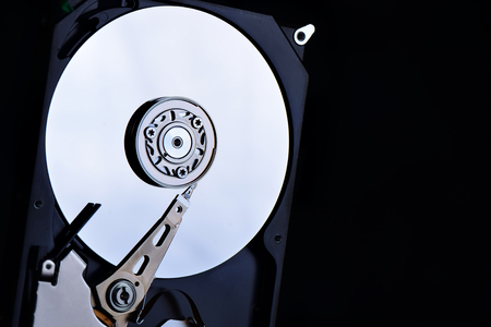 Close up hard disk on black background amd dark tone.の写真素材