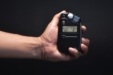 Light meter in hand.の写真素材