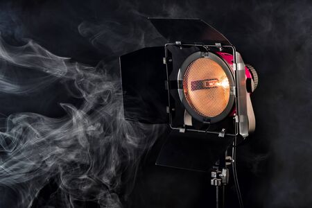 Studio lighting on black background with smoke effect