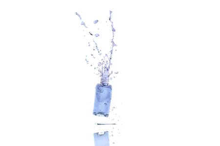 Splash water in bottle on white backgroundの写真素材