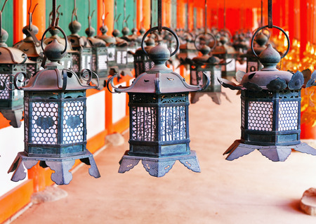Rows of metal lanterns hanging in Kasuga Taisha Shrine, Nara, Japanの写真素材