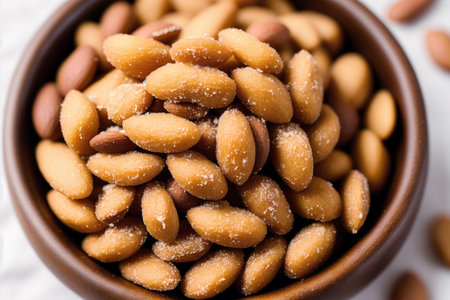 Almond Nuts in a bowl on white background. Selective focus.の素材