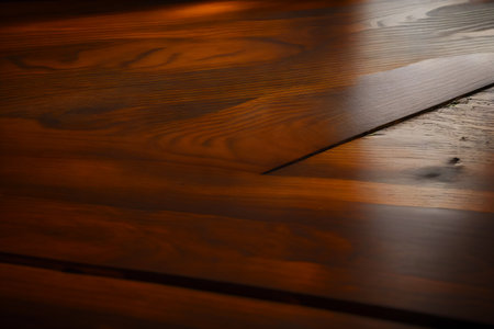 Wooden floor with light from the window. Selective focus.の素材