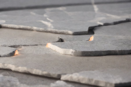 broken tiles on the ground in the city, closeup of photoの素材