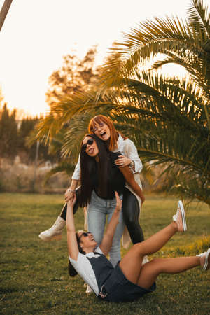 group of happy friends in nature. group of friends laughing and playing