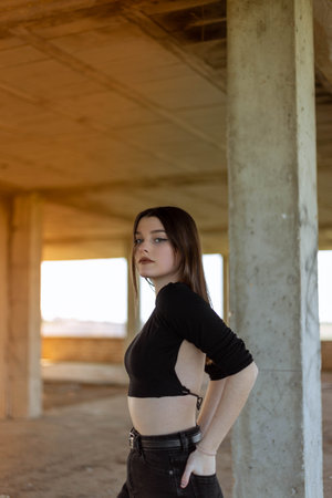 Portrait young woman on the street. Blue-eyed woman. Youth fashion. Urban style. Woman in a building under constructionの写真素材