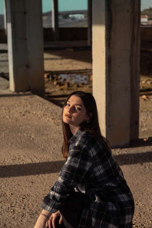 Portrait young woman on the street. Blue-eyed woman. Youth fashion. Urban style. Woman in a building under constructionの写真素材