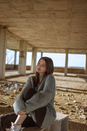Portrait young woman on the street. Blue-eyed woman. Youth fashion. Urban style. Woman in a building under constructionの写真素材