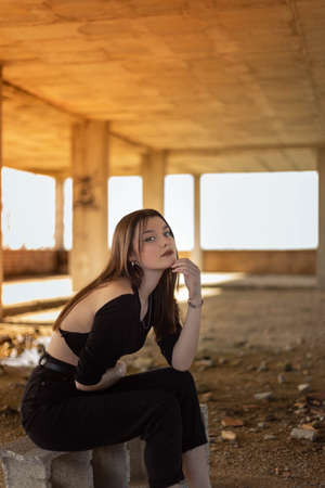 Portrait young woman on the street. Blue-eyed woman. Youth fashion. Urban style. Woman in a building under constructionの写真素材