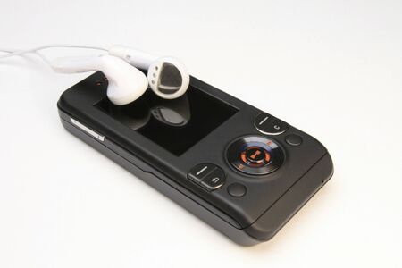 MP3 Player Cell Phone with earbuds on white backgroundの写真素材