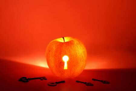 Apple with keyhole and keys concept shotの写真素材