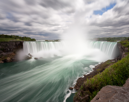 Niagara Falls long exposure from Canadian side with dramatic cloudsの写真素材