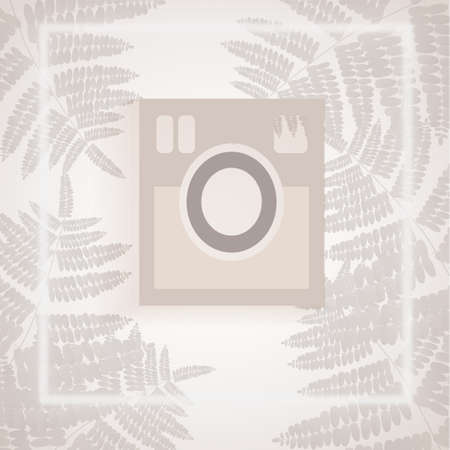 white camera in white and gray tropical leaves backdrop