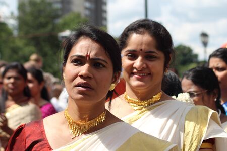 Bedford, England - July 21 - Asian women in traditional dress in the carnival parade at the bi-annual Bedford River Festival in England on 21 July 2012のeditorial素材