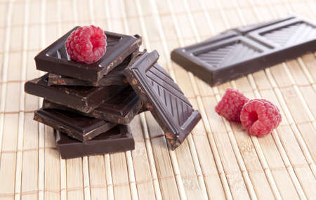 Dark chocolate with raspberries の写真素材