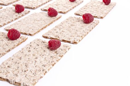 Raspberries over crispbread の写真素材