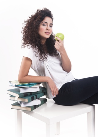 Attractive young lady taking some rest with an apple の写真素材