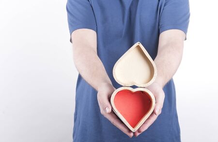 Young man sharing a red heart の写真素材