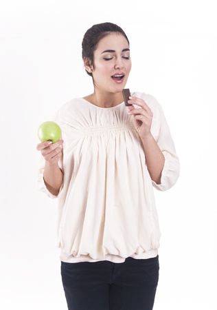 Pretty woman eating a waffleの写真素材