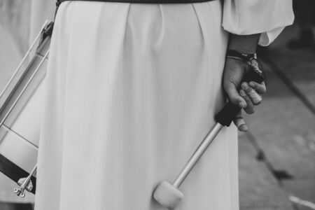 Rear view of a drummer holding a drumstick, Holy Weekの写真素材