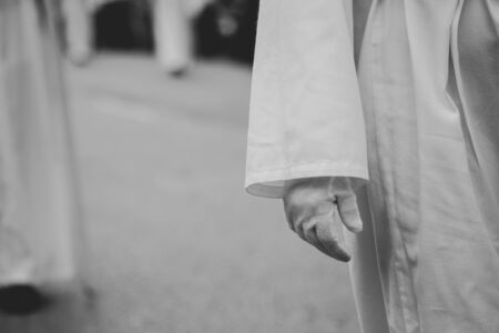 Close up of a white glove in a procession, Holy Weekの写真素材