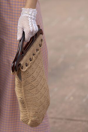 Woman wearing gloves and handbagの写真素材