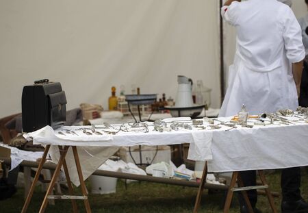 Antique Surgical Instruments and rear view of a doctorの写真素材