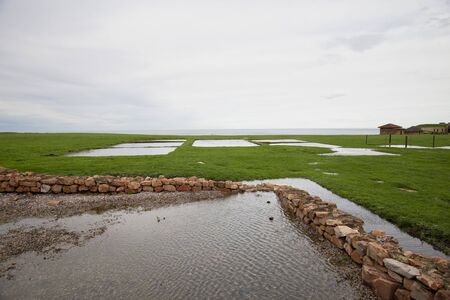 Meadow with puddles after rain, archaeological and natural Park of Campa-Torres