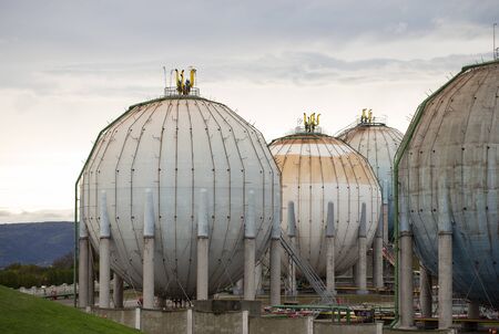 Old gas tanks of spherical formの写真素材