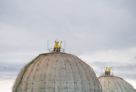 Old gas tanks of spherical formの写真素材