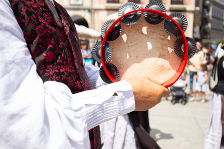 Musician holding a tambourineの写真素材