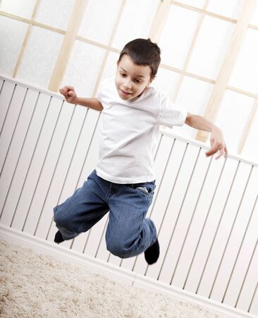 young boys playing and jumpingの写真素材