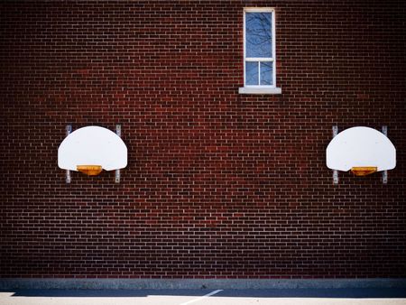 two basketball ring at a schoolの写真素材