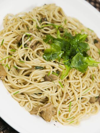 fresh pasta on a white plateの写真素材