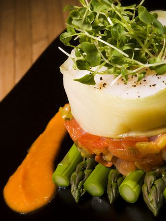 creative vegetable food with asparagus on black plateの写真素材
