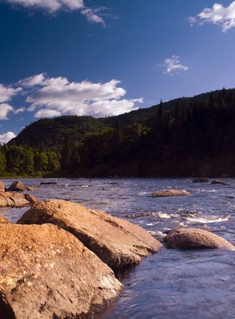 landscape with a river in a valley from Quebec Reserve Parc de la Jacques Cartier.の写真素材
