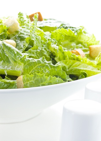 Caesar salad on white with parmesan cheese. の写真素材