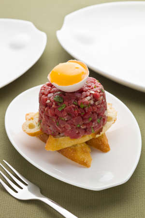tartar with bread and eggの写真素材