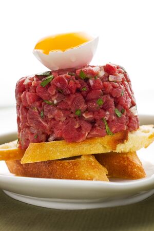 tartar with bread and eggの写真素材